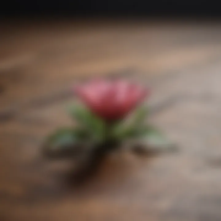 A wilted flower resting on a wooden surface, representing loss and transition.